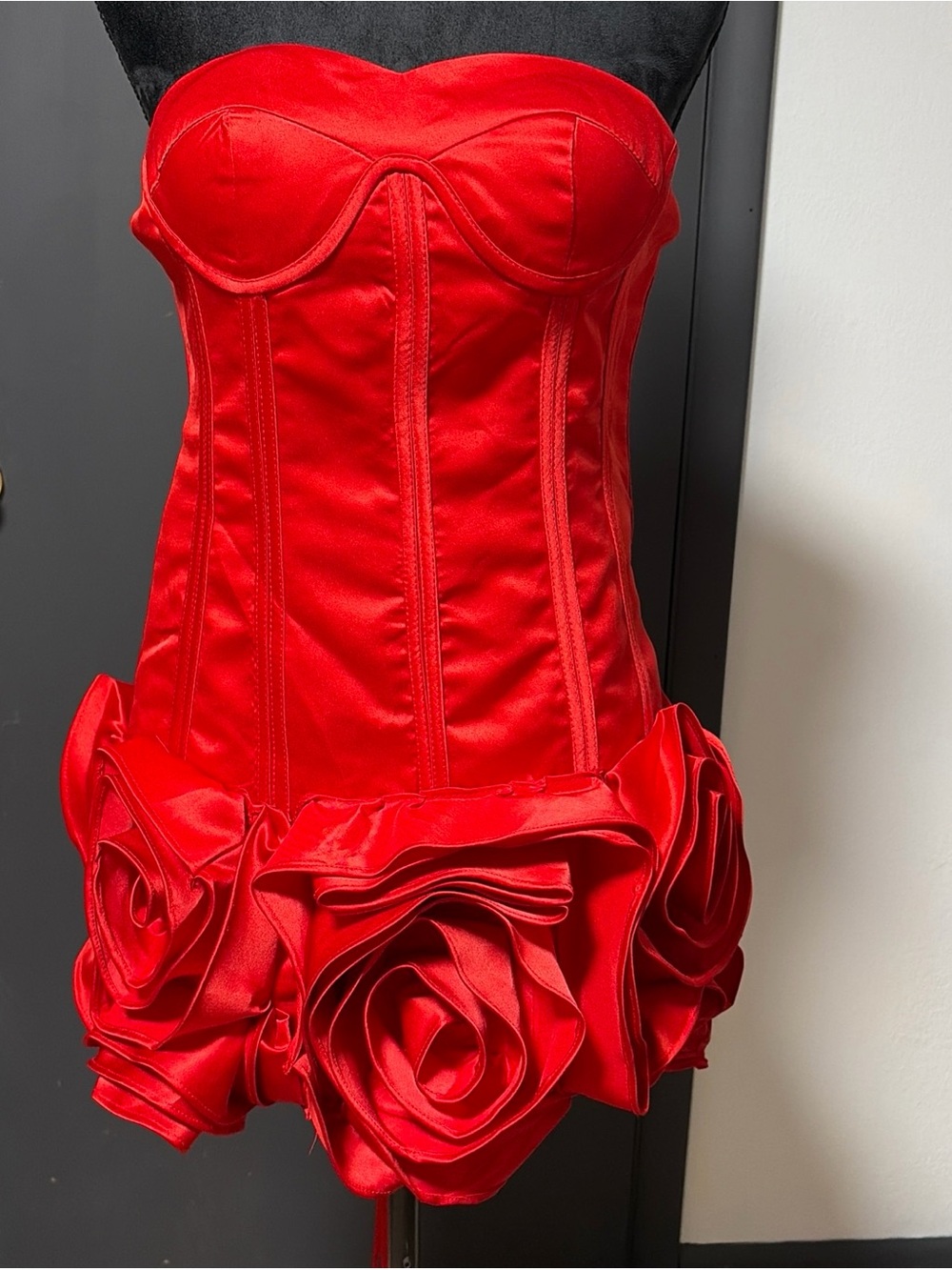 Bold Red Strapless Corset Dress with Rosette Hem